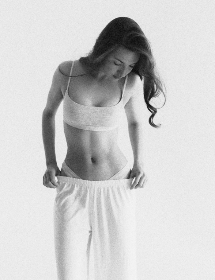 Black and white photo of a woman wearing a Lunaleila top and pants.