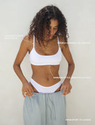 Model wearing white Support Bralette with white underwear